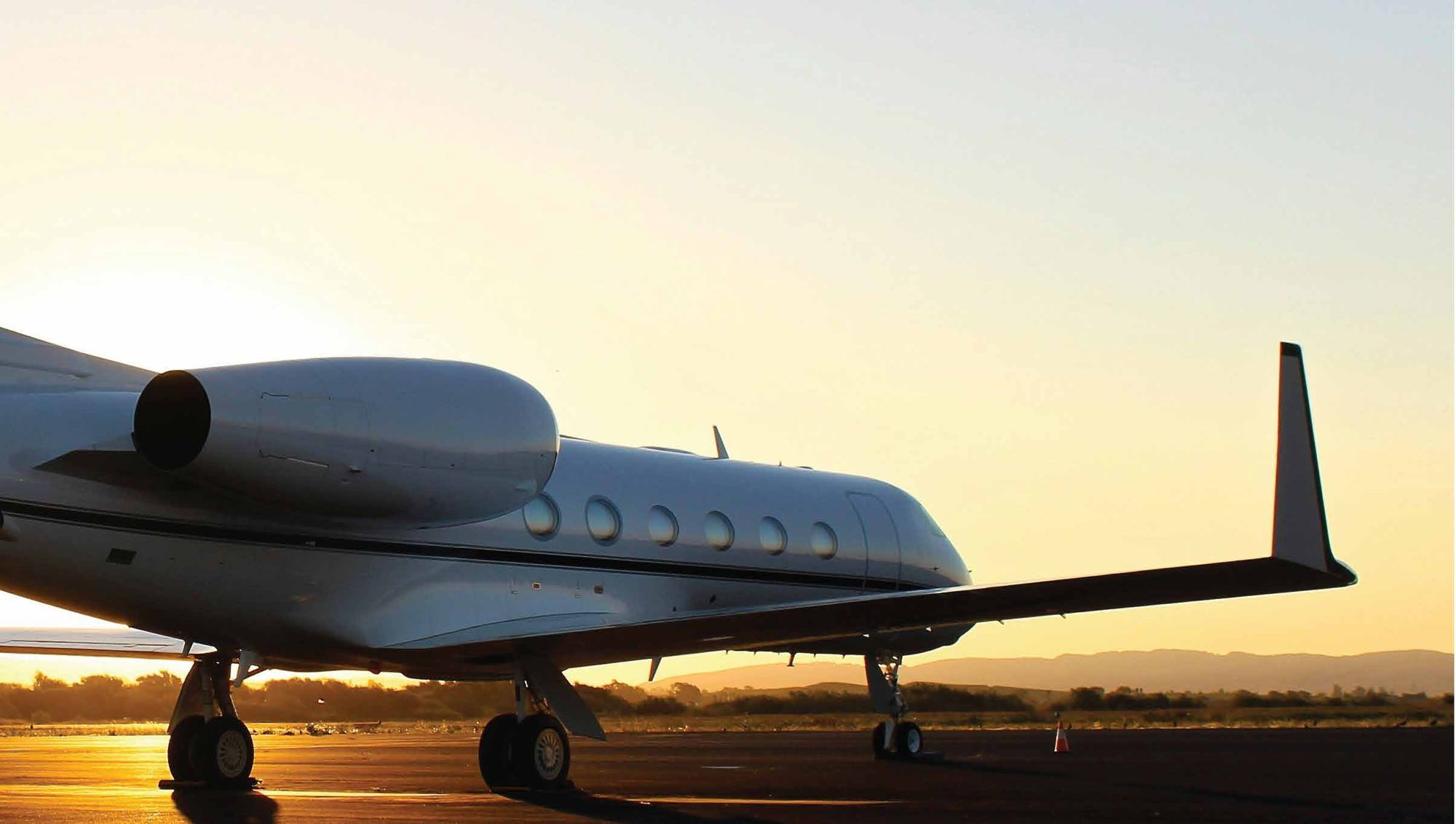 Private jet at sunset