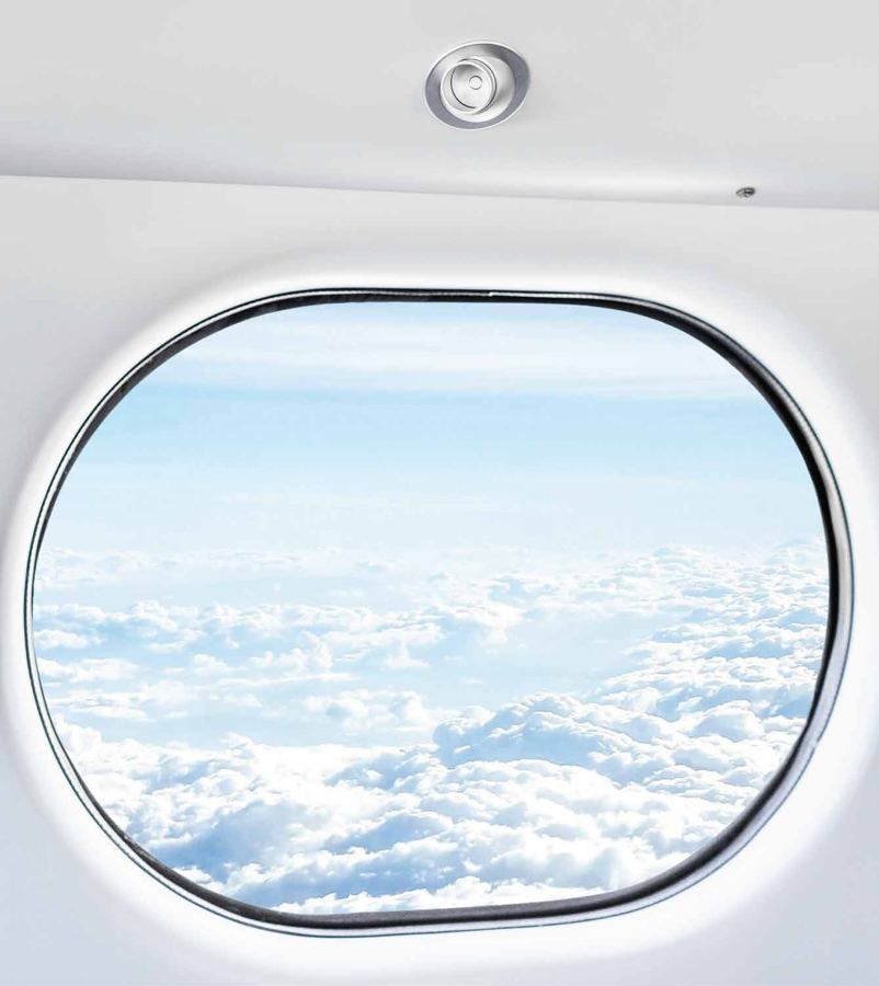 View from an aircraft window above the clouds
